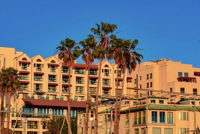 Residential buildings against blue sky