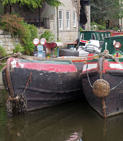 Abandoned boat moored in canal