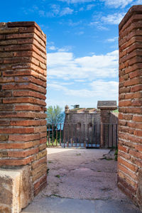 View of old building against cloudy sky