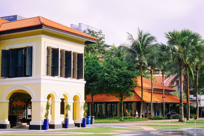 Exterior of building by street against sky