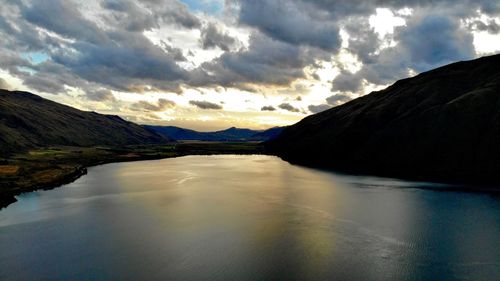 Scenic view of lake against sky during sunset