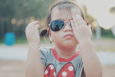 Portrait of cute girl wearing sunglasses