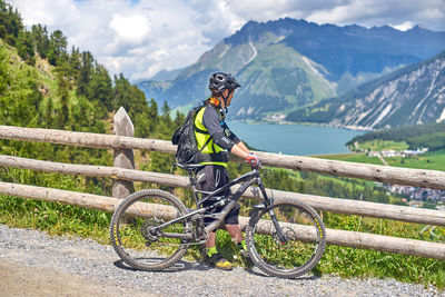 Man riding bicycle on mountain road