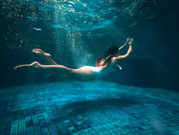 Woman swimming in pool