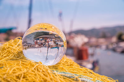 Close up of crystal ball on yellow rope