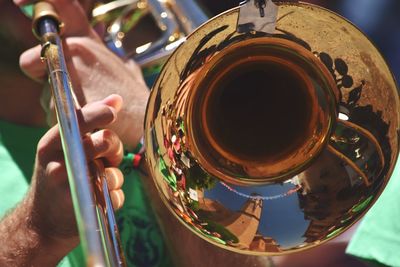 Close-up of person playing guitar