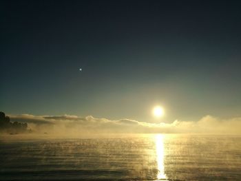 Scenic view of sea against sky at sunset