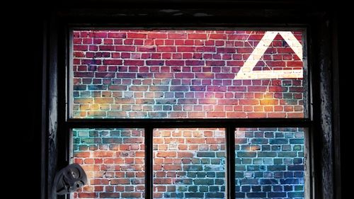 Close-up of window on brick wall