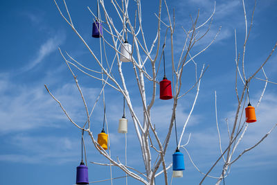 Low angle view of balloons against blue sky