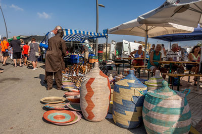 Group of people at market stall