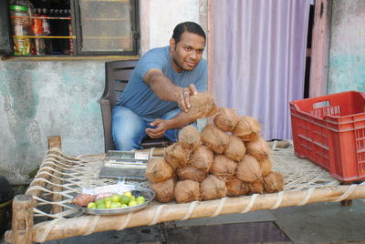 Coconut vendor with small shop