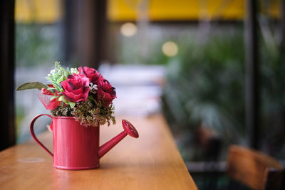 Close-up of red flower on table