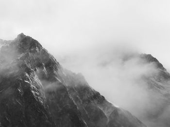 Scenic view of mountains in foggy weather