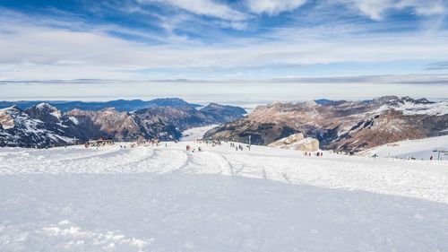 Scenic view of snow covered landscape against sky