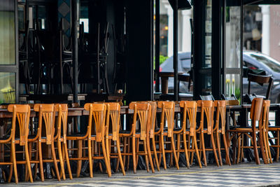 Empty chairs and tables in cafe