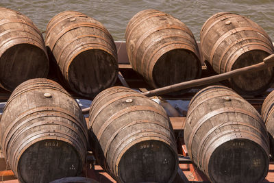 Barrels in boat on lake