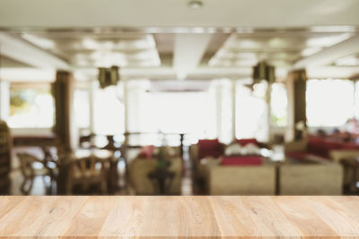 Empty chairs and tables in restaurant