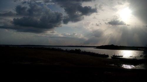 Scenic view of sea against dramatic sky