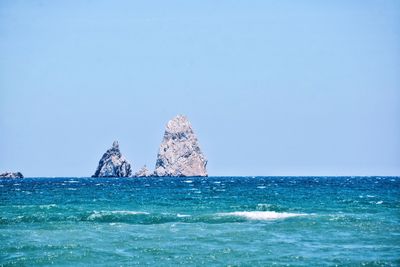 Scenic view of sea against clear sky