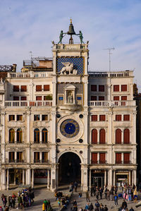 Group of people in front of historical building