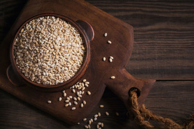 Organic uncooked dried barley cereal grain in a bowl