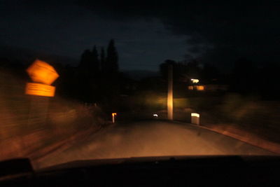 Close-up of illuminated road at night
