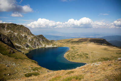 Scenic view of lake and mountains against sky