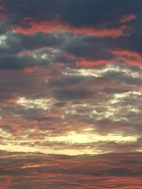 Low angle view of dramatic sky during sunset