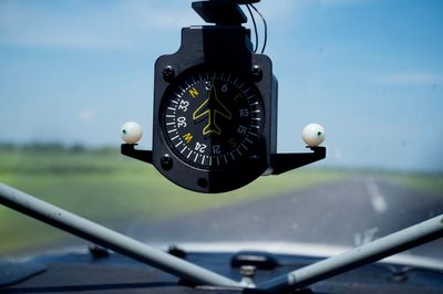 Close-up of compass gauge in airplane