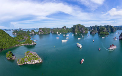 High angle view of boats in sea against sky