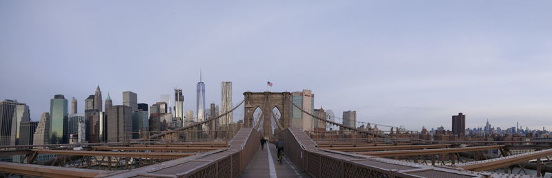 View of bridge and buildings against sky