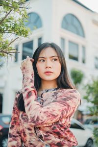 Portrait of young woman looking away