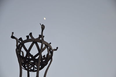 Low angle view of street light against sky