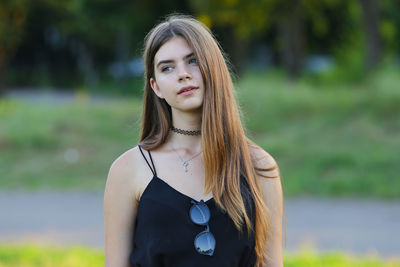 Young woman standing at park