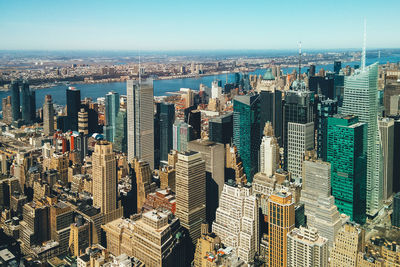 Aerial view of modern buildings in city against sky