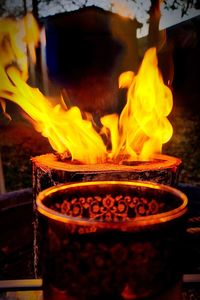 Close-up of lit candles in temple