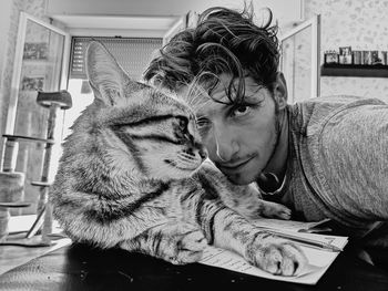 Man with cat at home