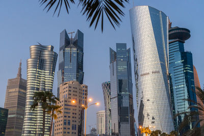 Low angle view of buildings against sky at dusk