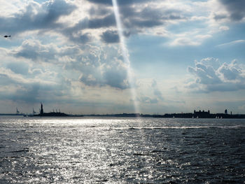 Scenic view of sea against storm clouds