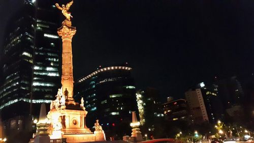 Low angle view of illuminated buildings at night