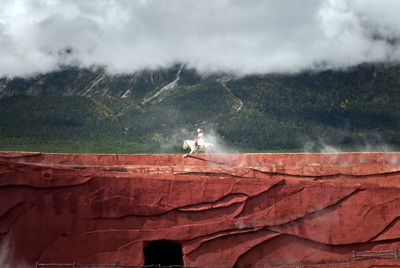 View of landscape against cloudy sky