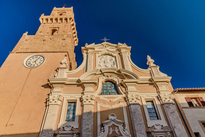 Low angle view of church against blue sky