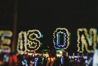 Close-up of illuminated carousel at amusement park