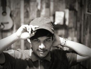 Portrait of young man wearing cap