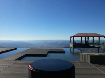 Infinity pool at resort against blue sky