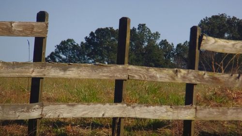 Wooden fence on field