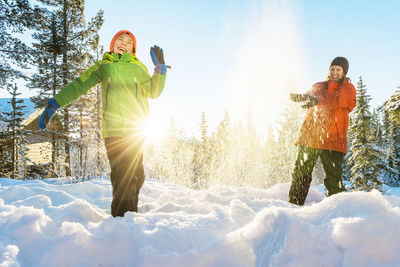 Mother with son playing at winter