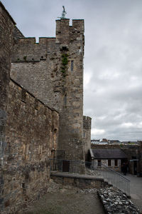 Old ruin building against cloudy sky