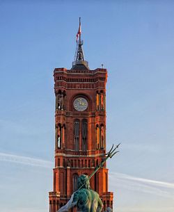 Low angle view of clock tower against sky