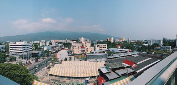 High angle view of buildings in city against sky